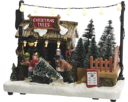 Beleuchtete Weihnachtsdekoration mit Weihnachtsbaumverkaufsszene
