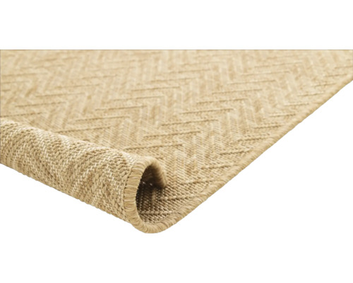 Vue détaillée d''un tapis beige à motif en zigzag