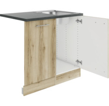 Meuble bas avec évier et porte ouverte