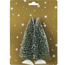 Zwei Miniatur-Weihnachtsbäume mit Schnee auf einer Karte