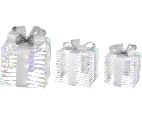 Drei dekorative, durchsichtige Geschenkboxen mit Schleife für die Weihnachtsdekoration.