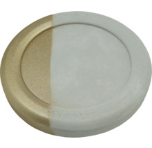 Dessous de verre rond en béton, partiellement doré