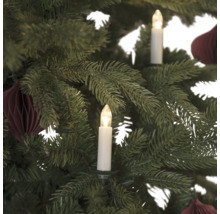 Gros plan d''un arbre de Noël avec des bougies et des décorations
