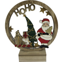 Décoration de Noël avec le Père Noël, sapin de Noël et des cadeaux dans un cadre en bois