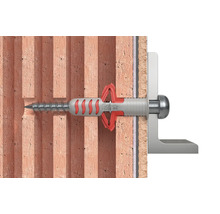 Fixation d''une vis avec cheville dans un mur de briques.