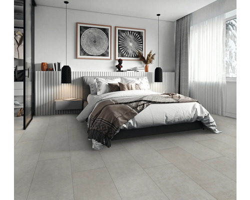 Chambre moderne avec lit double, table de chevet, suspensions et œuvres d'art murales