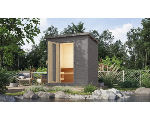 Chalet sauna Karibu Talos 1 avec poêle 9 KW et commande intégr. et porte en bois et verre isolant gris terre cuite Sauna de jardin grise avec porte ouverte et bancs en bois à l''intérieur