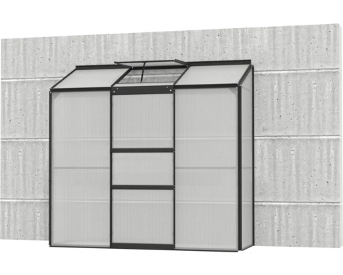 Serre en polycarbonate contre un mur