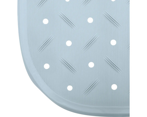 Détail d''un tapis de douche avec rainures et trous