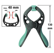 Serre-joint à ressort d'une longueur de 130 mm et d'une largeur de serrage maximale de 40 mm.