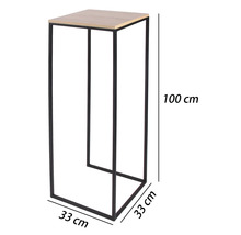 Hohe Pflanzensäule mit schwarzem Metallgestell und heller Ablage in Holzoptik, Maße 100 Zentimeter hoch sowie 33 mal 33 Zentimeter breit.